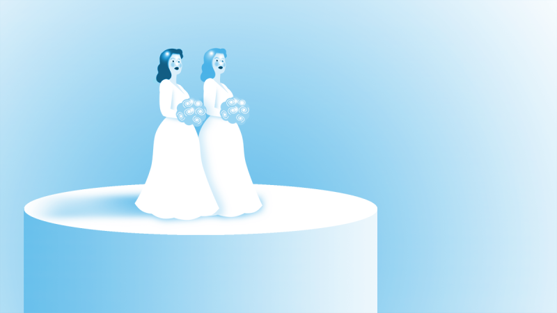 Two brides on a wedding cake