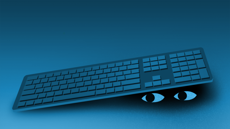Eyes peeking out from beneath keyboards