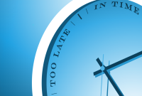 A clock with the words "in time" and "too late" instead of numbers